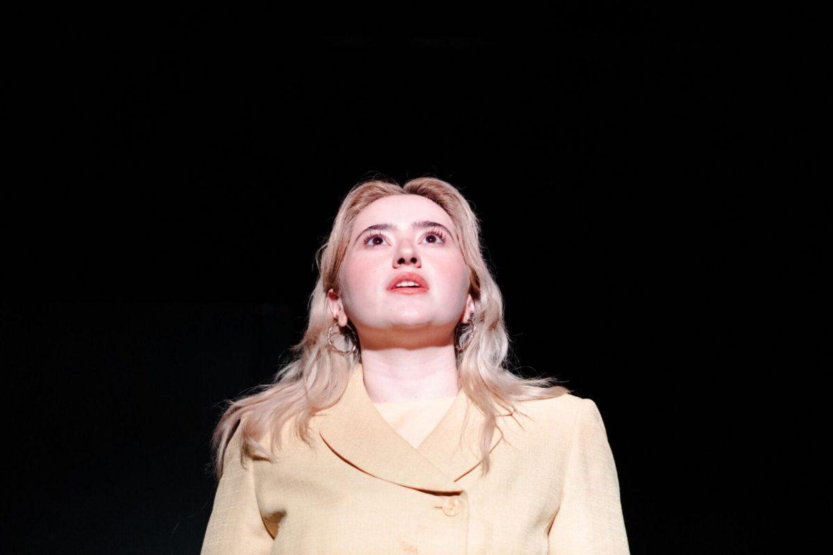 Older Nich Carraway (Sophie Rollins) speaks in a production of Yearning Sunday, March 3, 2024, in Coates Hall on LSU's campus.