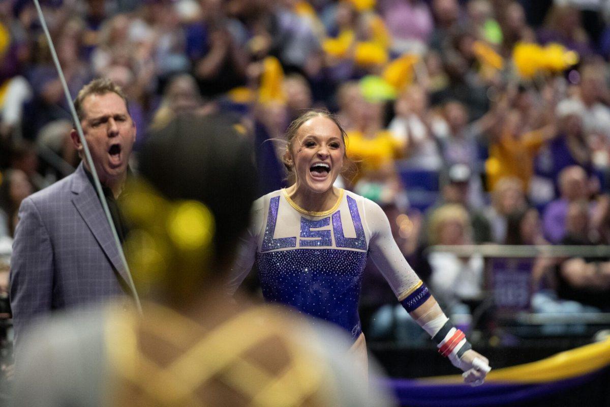 LSU gymnastics graduate student all-around Savannah Schoenherr celebrates Friday, March 15, 2024, during LSU's 198.250-196.075 win against North Carolina at the Pete Maravich Assembly Center in Baton Rouge, La.