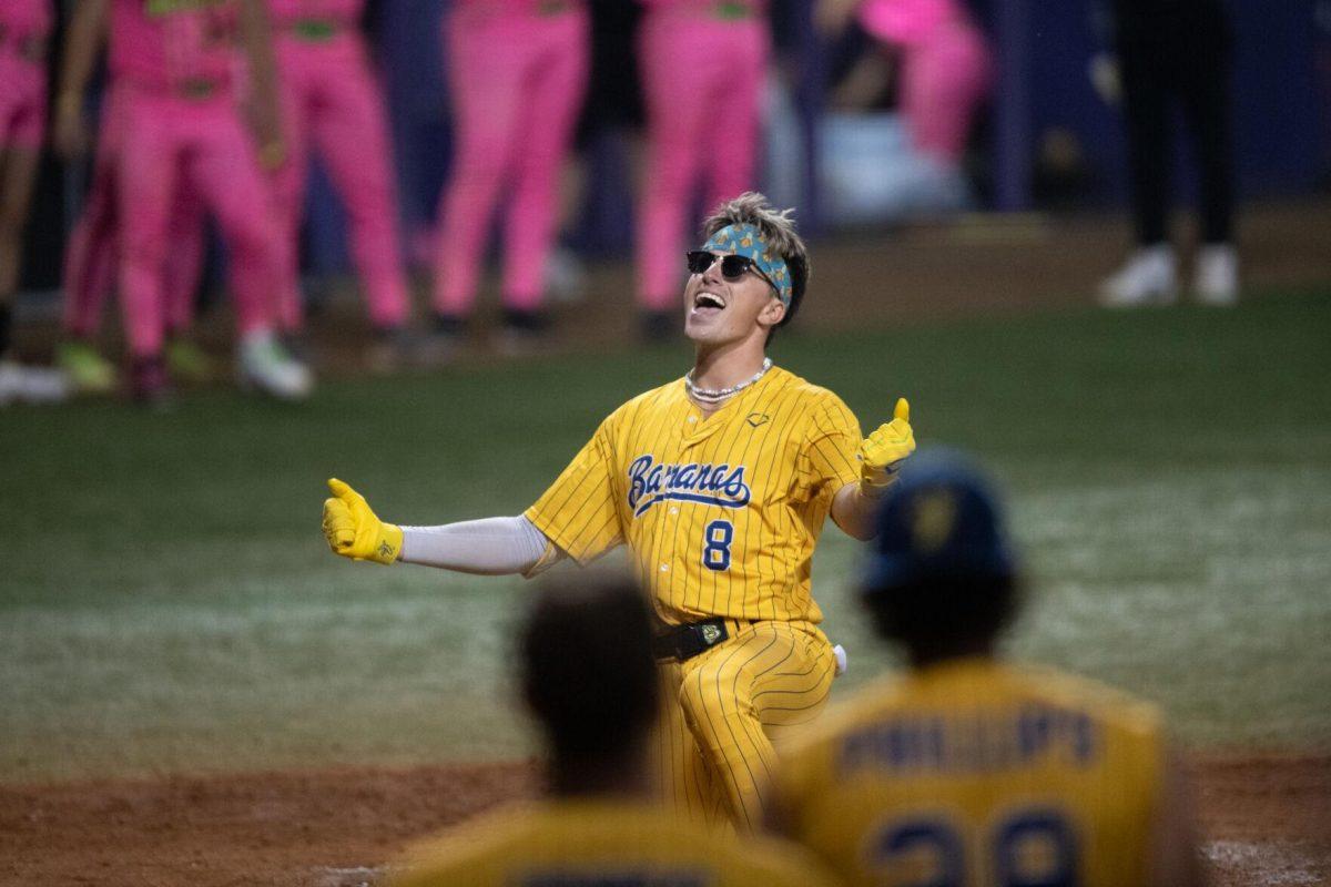 Savannah Bananas infielder Jackson Olson (8) performs "I'm Just Ken" Thursday, March 14, 2024, during the Savannah Bananas 5-4 loss to the Party Animals during their world tour stop at Alex Box Stadium in Baton Rouge, La.