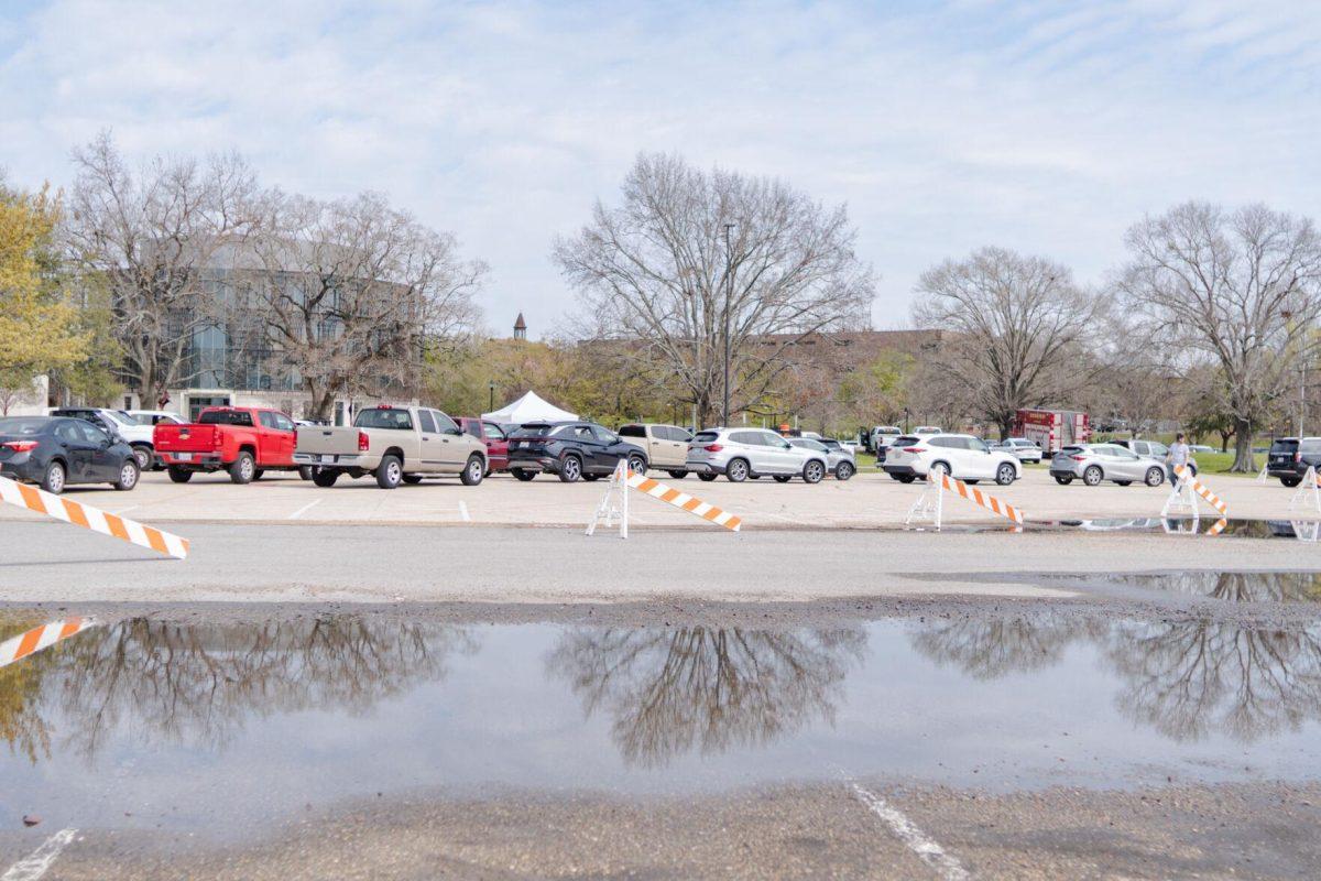 Vehicles wait in line to dispose of their materials Saturday, March 2, 2024, at the Household Hazardous Materials Collection Day on LSU's campus in Baton Rouge, La.