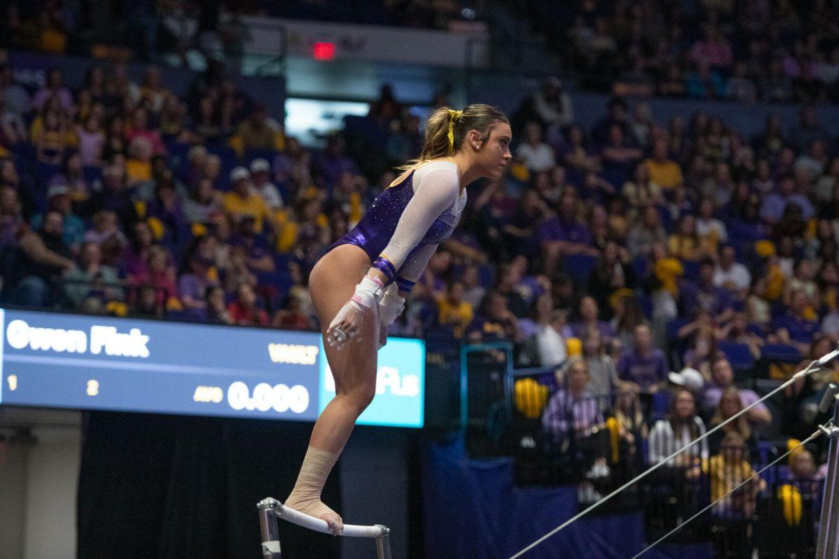 LSU gymnastics junior all-around Alexis Jeffrey stands on an uneven bar Friday, March 15, 2024, during LSU's 198.250-196.075 win against North Carolina at the Pete Maravich Assembly Center in Baton Rouge, La.