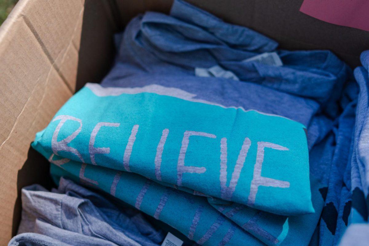 Believe t-shirts sit in a box Tuesday, March 26, 2024, at the Believe March on LSU's campus.