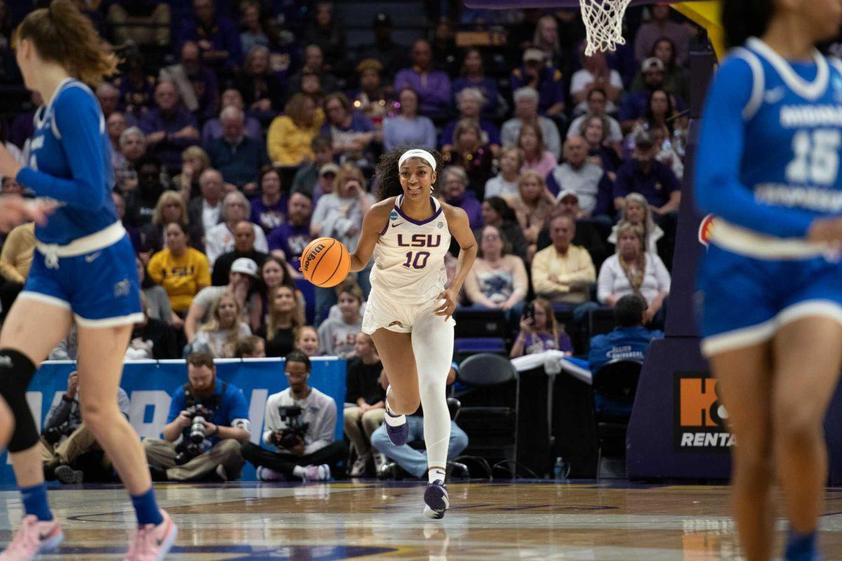 LSU women&#8217;s basketball&#160;junior forward Angel Reese (10) smiles as she dribbles down the court Sunday, March 24, 2024, during&#160;LSU&#8217;s 83-56 second-round NCAA tournament win against Middle Tennessee at the Pete Maravich Center in Baton Rouge, La.