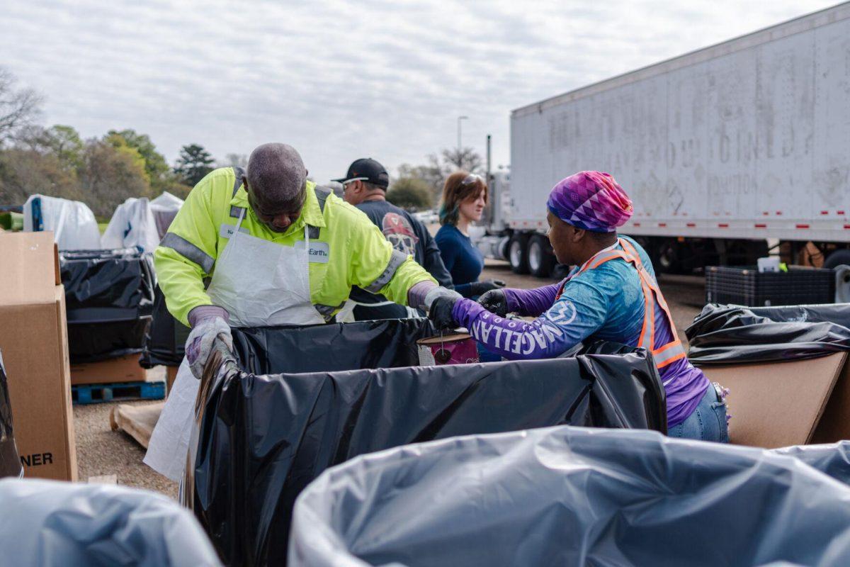 Workers sort various materials into boxes Saturday, March 2, 2024, at the Household Hazardous Materials Collection Day on LSU's campus in Baton Rouge, La.