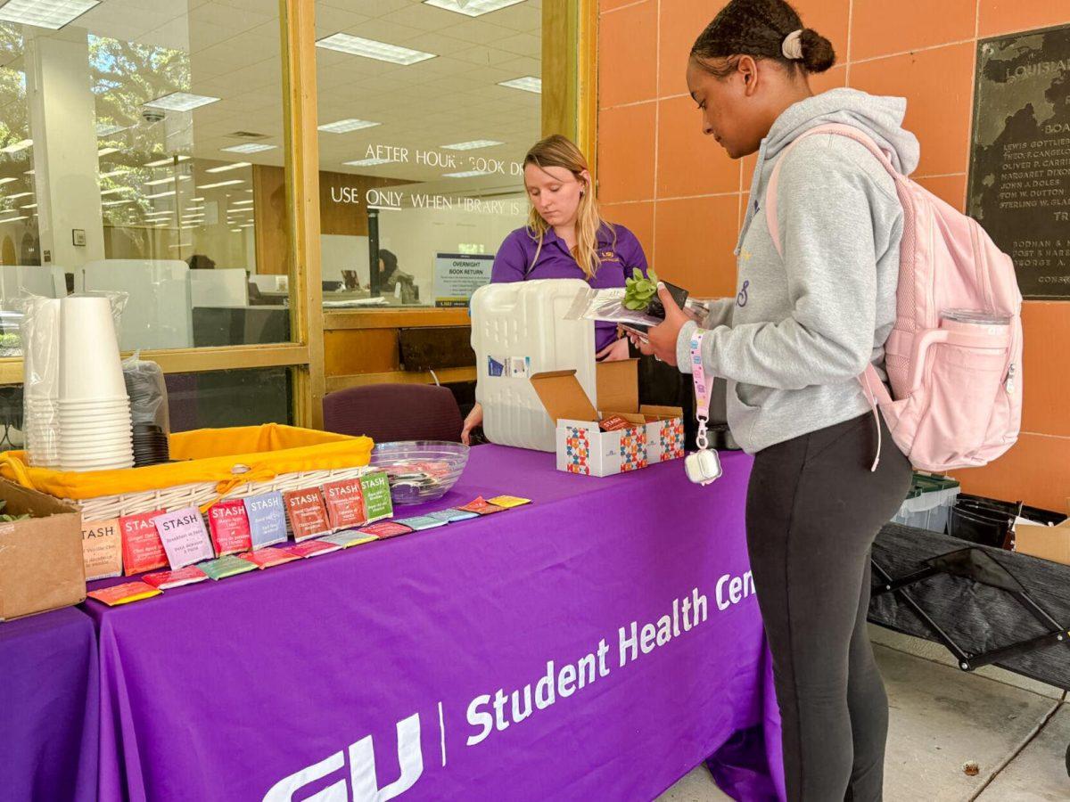 Students gather outside the Library Thursday, March 28, 2024, on LSU's campus in Baton Rouge, La.