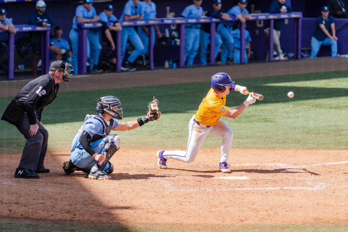 LSU baseball senior outfielder Mac Bingham (9) puts down a bunt Sunday, March 10, 2024, during LSU's 2-1 loss to Xavier in Alex Box Stadium in Baton Rouge, La.