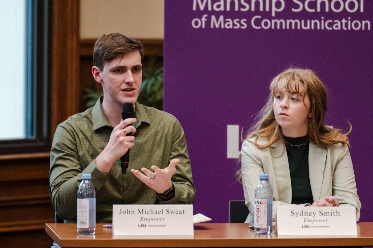 John Michael Sweat answers a question as Sydney Smith listens Monday, March 18, 2024, inside the Holliday Forum at LSU in Baton Rouge, La.