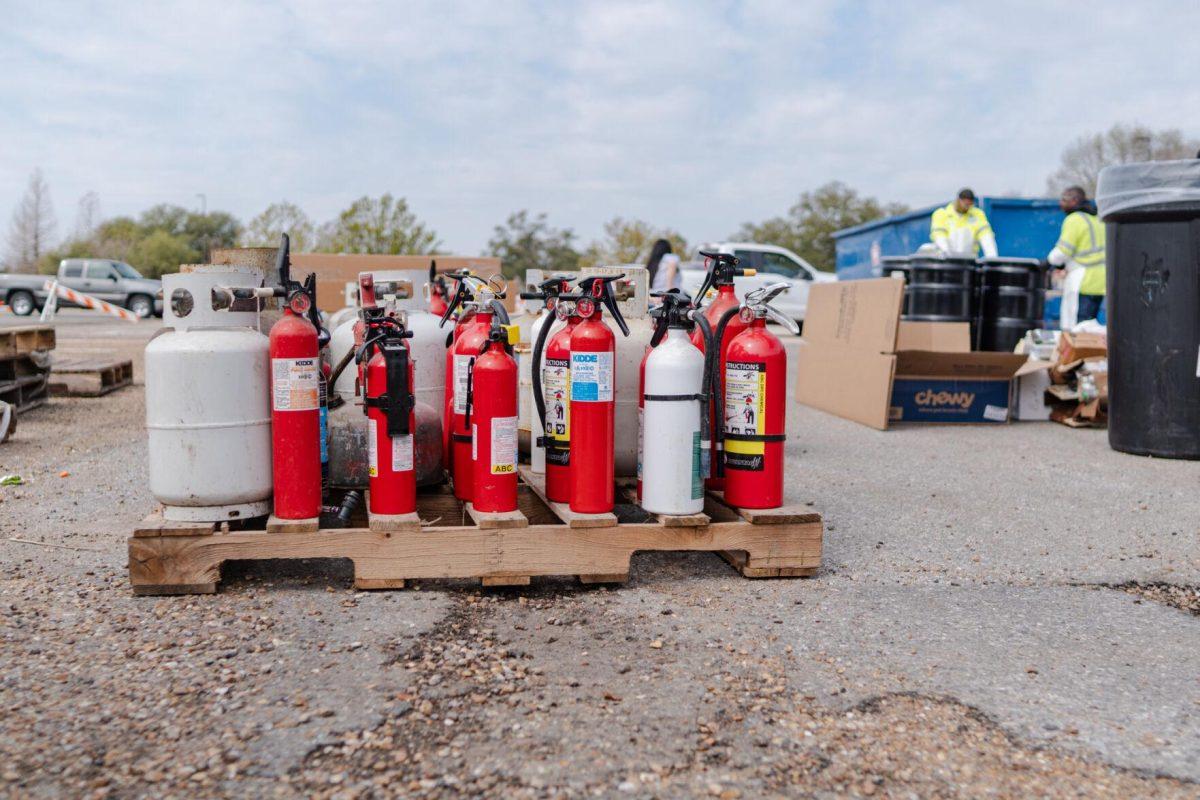 Fire extinguishers sit on a pallet Saturday, March 2, 2024, at the Household Hazardous Materials Collection Day on LSU's campus in Baton Rouge, La.