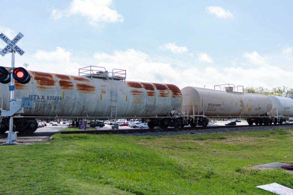 A train rolls along its tracks Friday, March 22, 2024, near Nicholson Drive in Baton Rouge, La.