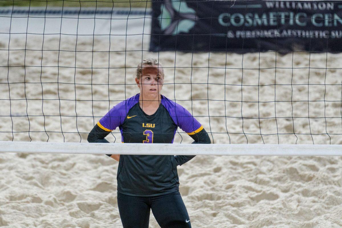 LSU beach volleyball junior Ella Larkin (3) awaits the serve Saturday, March 2, 2024, during LSU&#8217;s 5-0 win against Nebraska at the LSU Beach Volleyball Stadium in Baton Rouge, La.