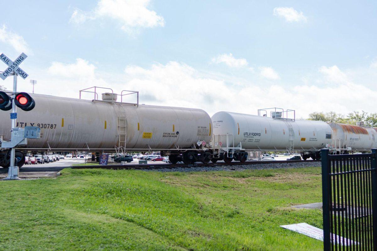 A train rolls along its tracks Friday, March 22, 2024, near Nicholson Drive in Baton Rouge, La.