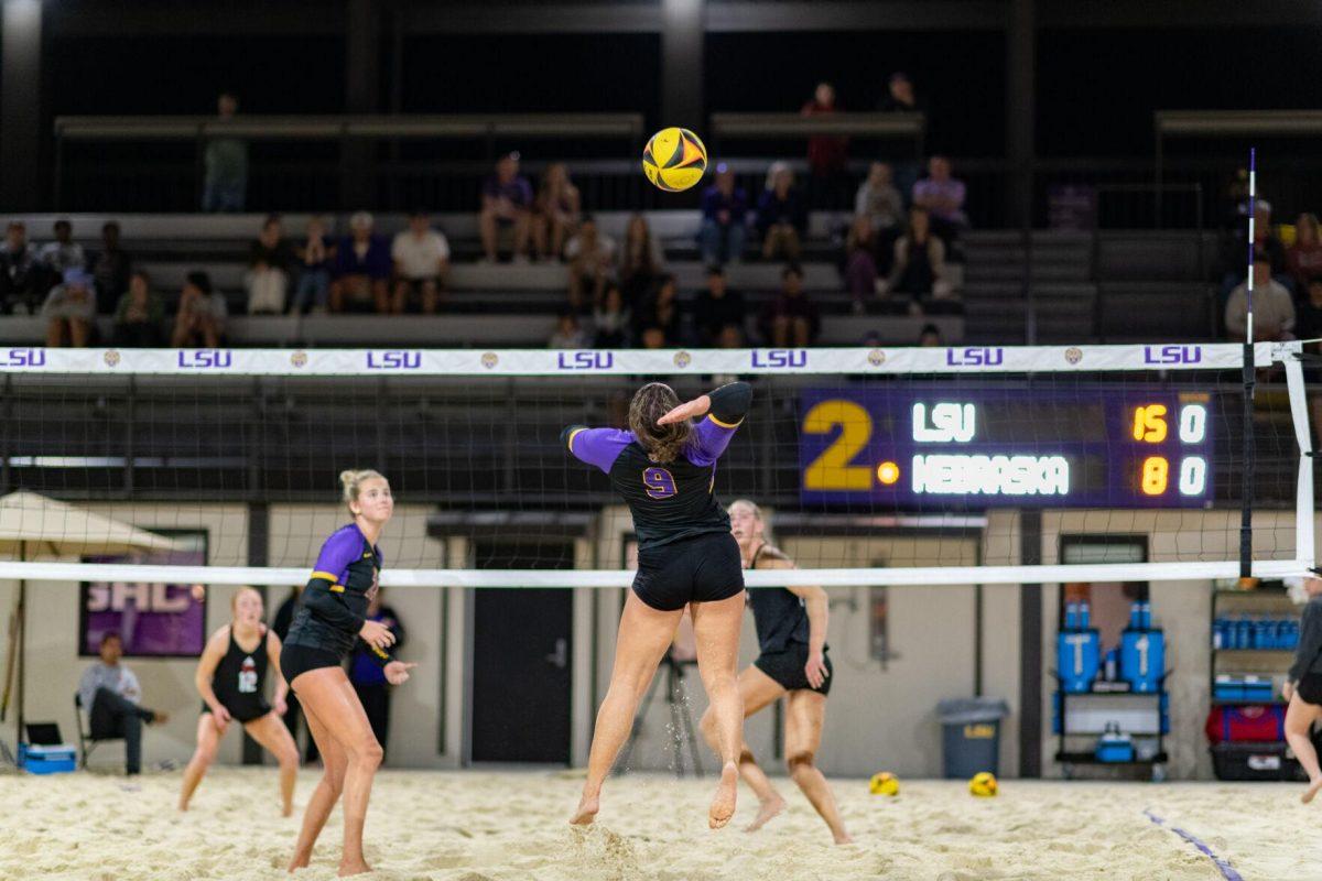 LSU beach volleyball freshman Skylar Martin (9) hits the ball over the net Saturday, March 2, 2024, during LSU's 5-0 win against Nebraska at the LSU Beach Volleyball Stadium in Baton Rouge, La.