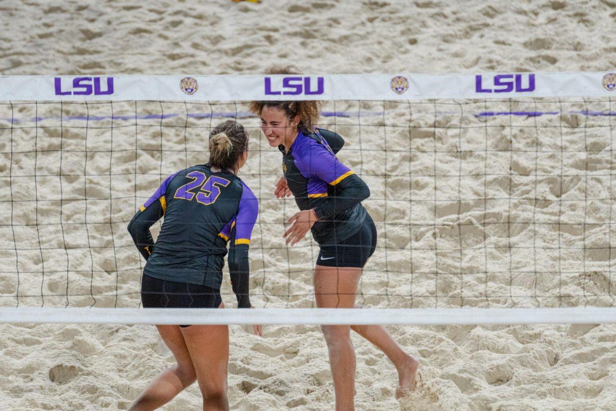 LSU beach volleyball senior Emily Meyer (25) and freshman Yali Ashush (26) celebrate Saturday, March 2, 2024, during LSU&#8217;s 5-0 win against Nebraska at the LSU Beach Volleyball Stadium in Baton Rouge, La.