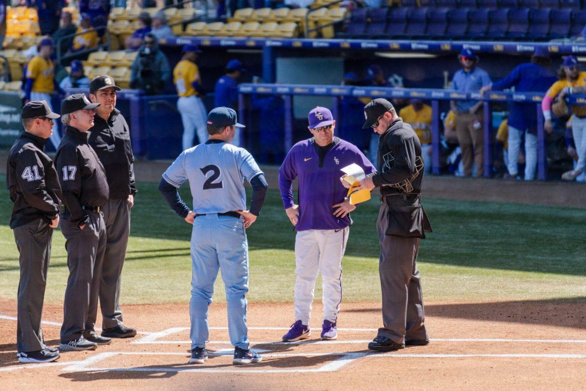 LSU baseball head coach Jay Johnson speaks with Xavier's coach Billy O'Conner and the umpires Sunday, March 10, 2024, prior to LSU's 2-1 loss to Xavier in Alex Box Stadium in Baton Rouge, La.