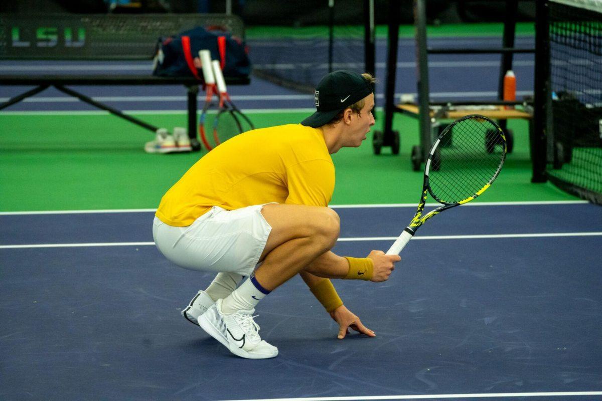 LSU men's tennis junior Julien Penzlin readies at the net during his unfinished 7-6, 5-5 doubles match against Ole Miss Friday, March 8, 2024, at the LSU tennis complex on Gourrier Avenue in Baton Rouge, La.