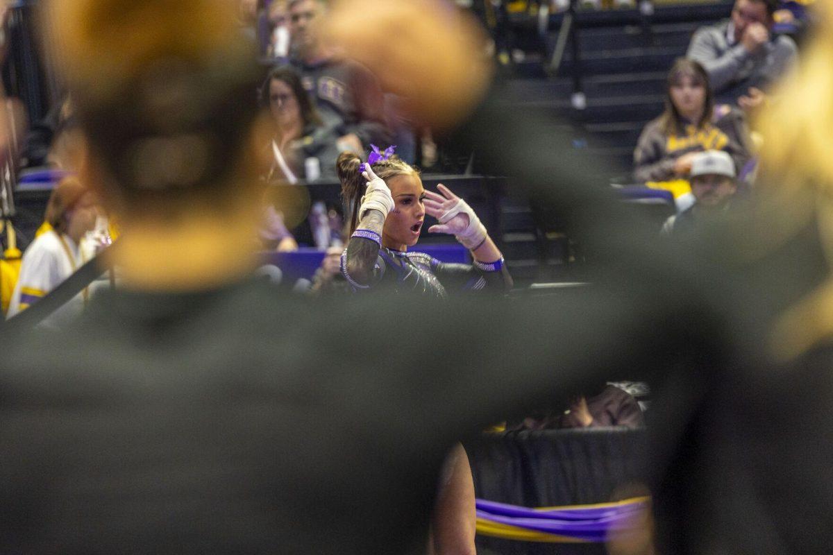 LSU gymnastics junior all-around KJ Johnson goes through her floor exercise routine Friday, March 1, 2024, during LSU's 198.325-197.325 win over Alabama in the Pete Maravich Assembly Center.