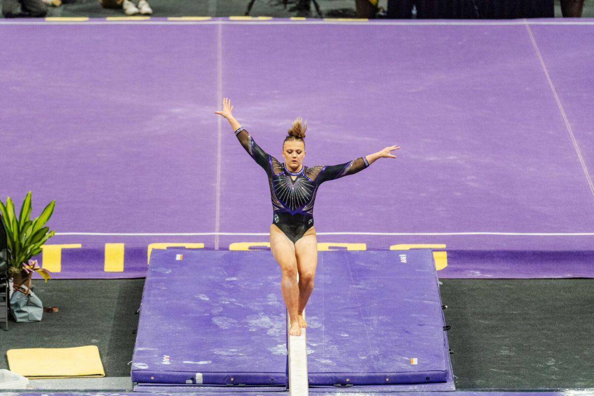 LSU gymnastics vault/balance beam/floor exercise graduate student Sierra Ballard sticks the landing on the beam Friday, March 1, 2024, during LSU&#8217;s 198.325-197.325 win against Alabama in the Pete Maravich Assembly Center in Baton Rouge, La.