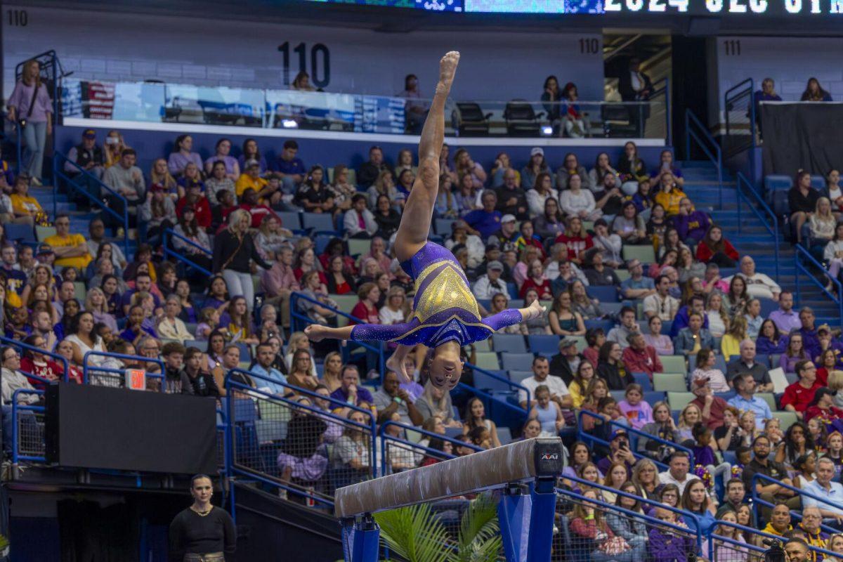LSU gymnastics junior all-around Aleah Finnegan rotates through the air Saturday, March 23, 2024, during LSU's 198.075 victory in the 2024 SEC Gymnastics Championship in the Smoothie King Center in New Orleans, La.