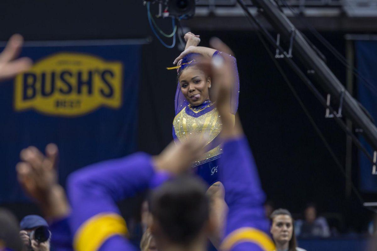 LSU gymnastics freshman all-around Konnor McClain reacts to her team's support during her floor exercise routine Saturday, March 23, 2024, during LSU's 198.075 victory in the 2024 SEC Gymnastics Championship in the Smoothie King Center in New Orleans, La.