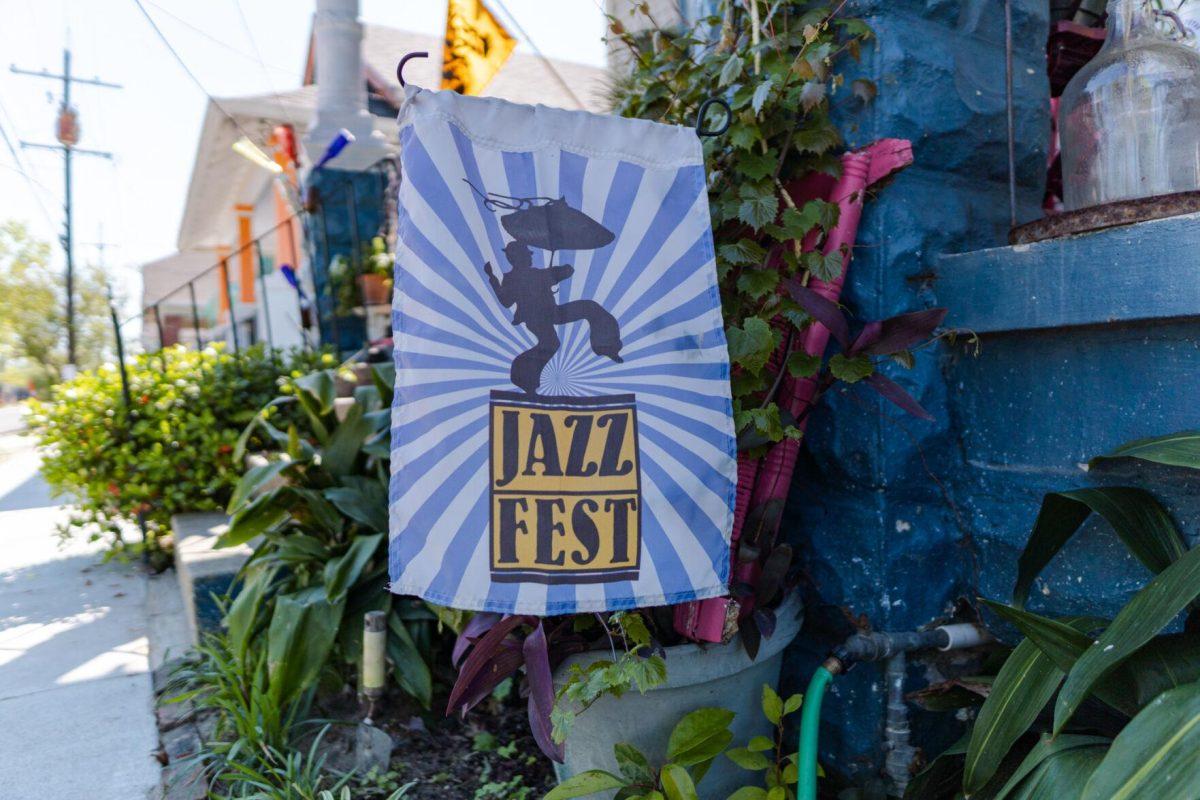 A Jazz Fest banner hangs in front of a home Friday, March 29, 2024, on Fortin Street in New Orleans, La.