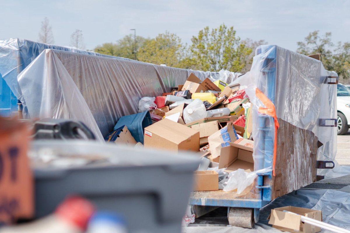 Various boxes and containers sit in a dumpster Saturday, March 2, 2024, at the Household Hazardous Materials Collection Day on LSU's campus in Baton Rouge, La.