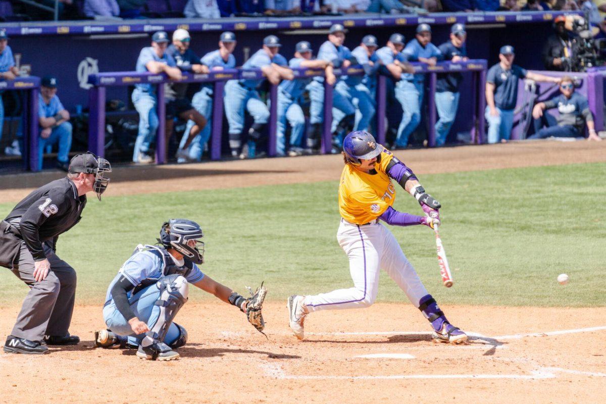 LSU baseball graduate student catcher Hayden Travinski (8) swings for the ball Sunday, March 10, 2024, during LSU's 2-1 loss to Xavier in Alex Box Stadium in Baton Rouge, La.