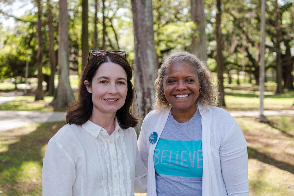 Executive Director of the Student Health Center Julie Hupperich (left) and Director of the Lighthouse Program Kreslyn Kelley-Ellis (right) stand for a photo Tuesday, March 26, 2024, at the Believe March on LSU's campus.