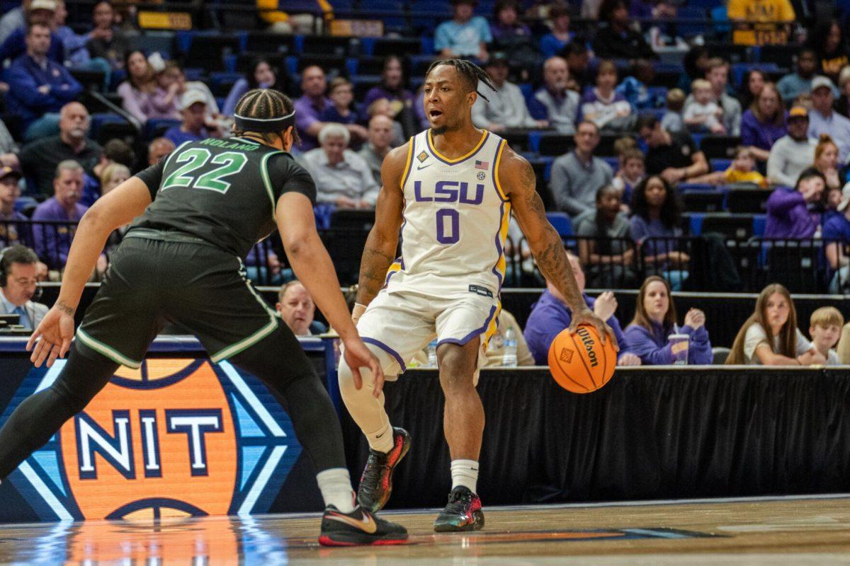 LSU men&#8217;s basketball 5th-year senior guard Trae Hannibal (0) dribbles the ball Tuesday, March 19, 2024, during LSU&#8217;s 84-77 loss to the University of North Texas at the PMAC in Baton Rouge, La.