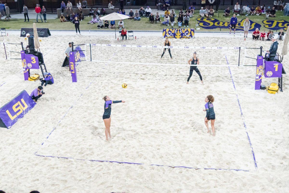 LSU beach volleyball senior Emily Meyer (25) hits the ball up Saturday, March 2, 2024, during LSU&#8217;s 5-0 win against Nebraska at the LSU Beach Volleyball Stadium in Baton Rouge, La.