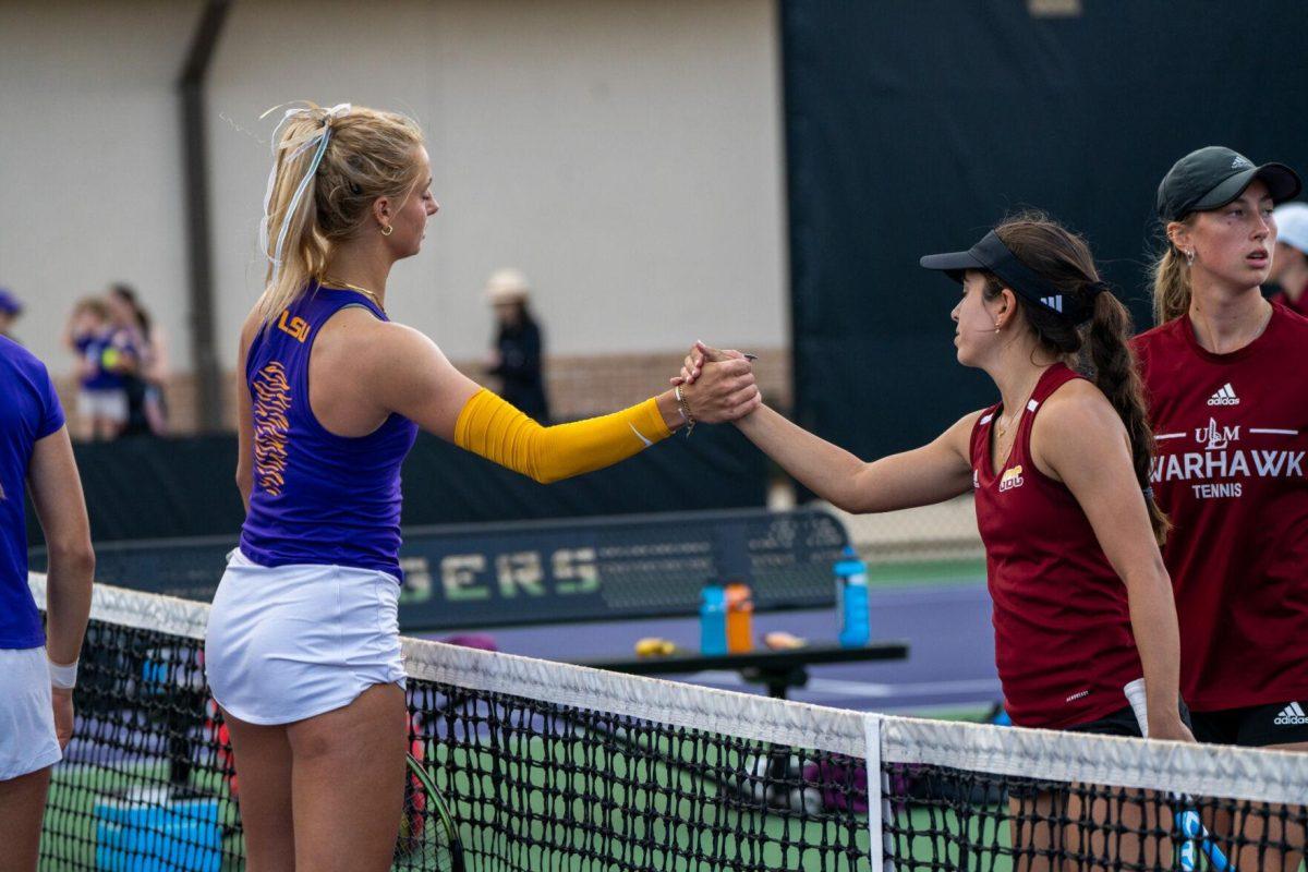 LSU women's tennis junior Florentine Dekkers shakes her opponent's hand during her 6-0 win against ULM Sunday, March 3, 2024, at the LSU Tennis Complex on Gourrier Avenue in Baton Rouge, La.