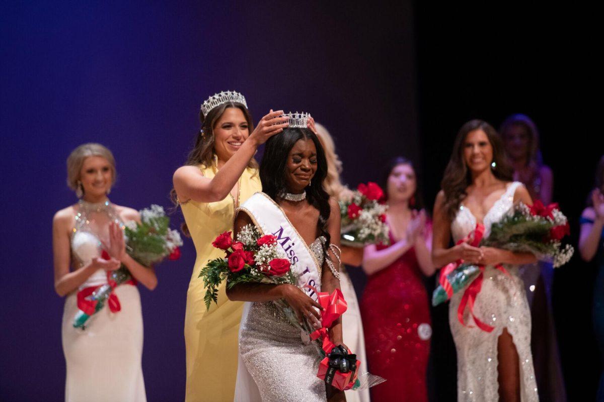 LSU mass communications senior Ivy Robichaux crowns kinesiology sophomore Nikhia Sims as the new Miss LSU Sunday, March 24, 2024, during Delta Zeta's Miss LSU 2024 Pageant in the Union Theater in Baton Rouge, La.