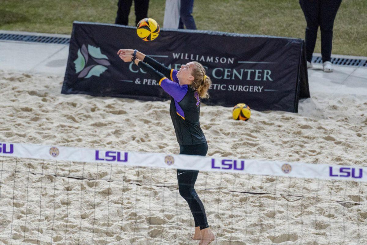 LSU beach volleyball junior Ella Larkin (3) hits the ball up Saturday, March 2, 2024, during LSU&#8217;s 5-0 win against Nebraska at the LSU Beach Volleyball Stadium in Baton Rouge, La.