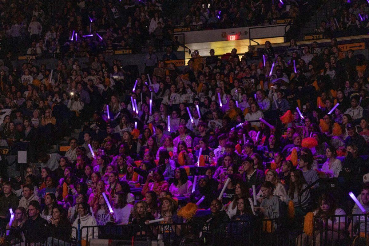 The LSU student section is bathed in purple light Friday, March 1, 2024, during LSU's 198.325-197.325 win over Alabama in the Pete Maravich Assembly Center.