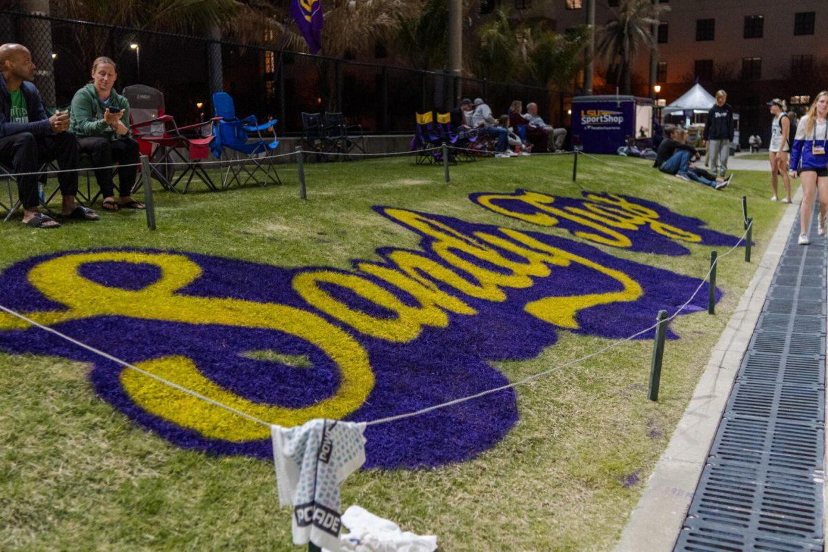 Painted letters spell out "Sandy Tigs" Saturday, March 2, 2024, during LSU&#8217;s 5-0 win against Nebraska at the LSU Beach Volleyball Stadium in Baton Rouge, La.