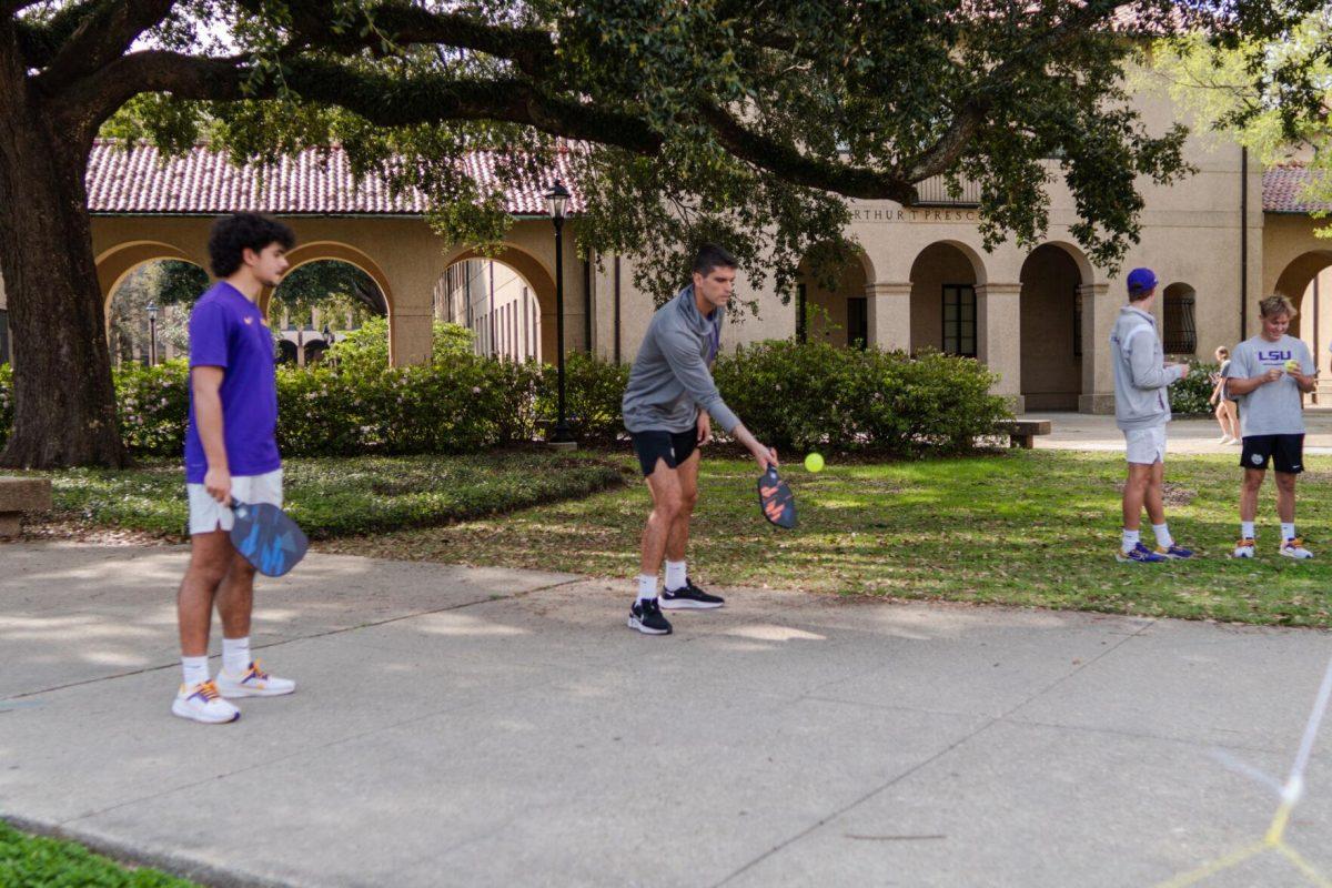 LSU men's tennis 5th-year senior Stefan Latinovic hits the ball Thursday, March 7, 2024, in the Quad on LSU's campus in Baton Rouge, La.