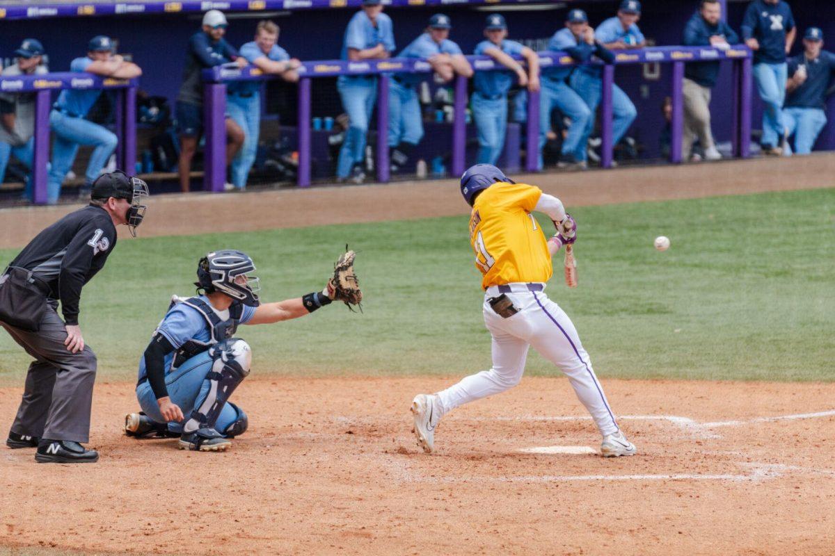 LSU baseball junior outfielder Josh Pearson (11) swings for the ball Sunday, March 10, 2024, during LSU's 2-1 loss to Xavier in Alex Box Stadium in Baton Rouge, La.