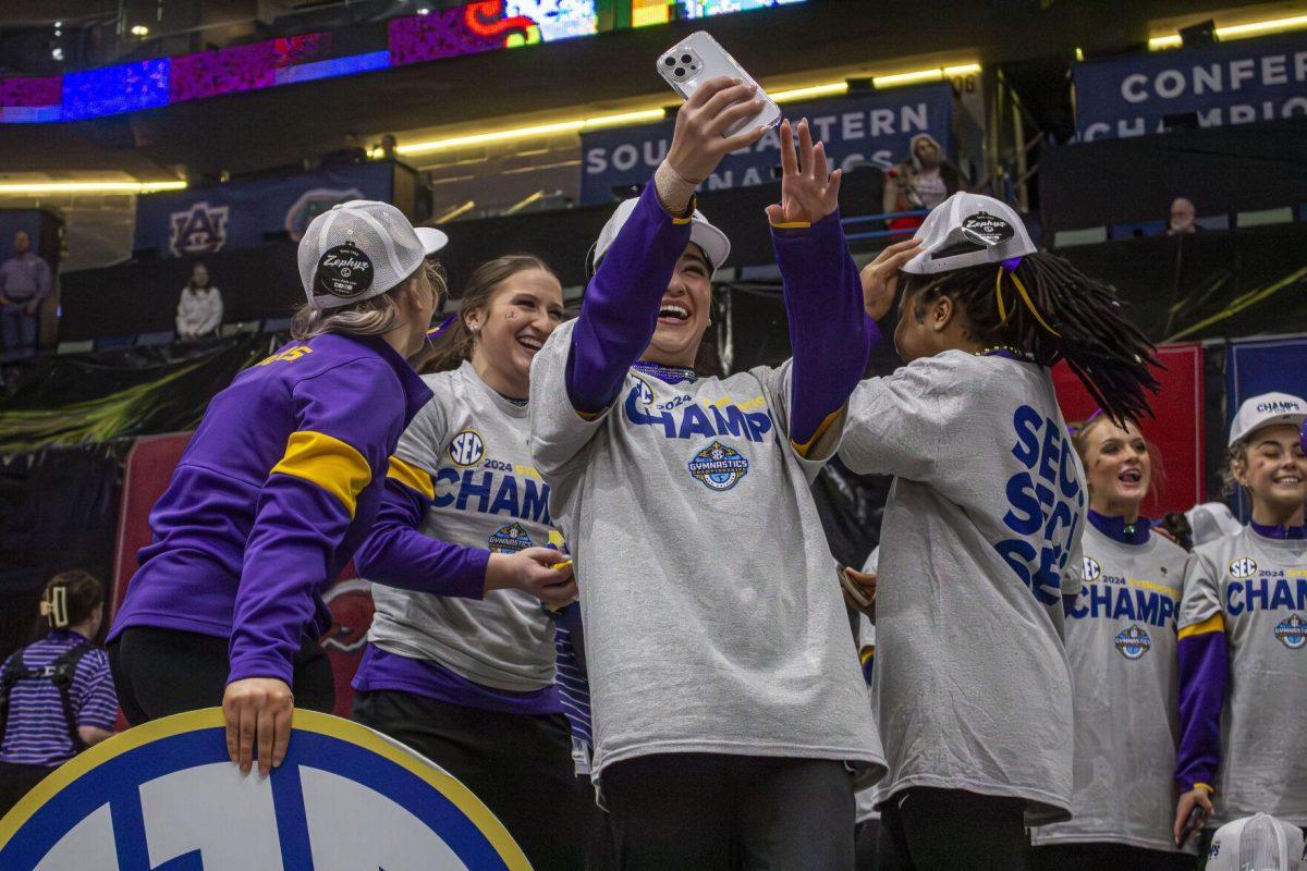 LSU gymnastics junior all-around Aleah Finnegan poses for a selfie with her teammates Saturday, March 23, 2024, following LSU's 198.075 victory in the 2024 SEC Gymnastics Championship in the Smoothie King Center in New Orleans, La.