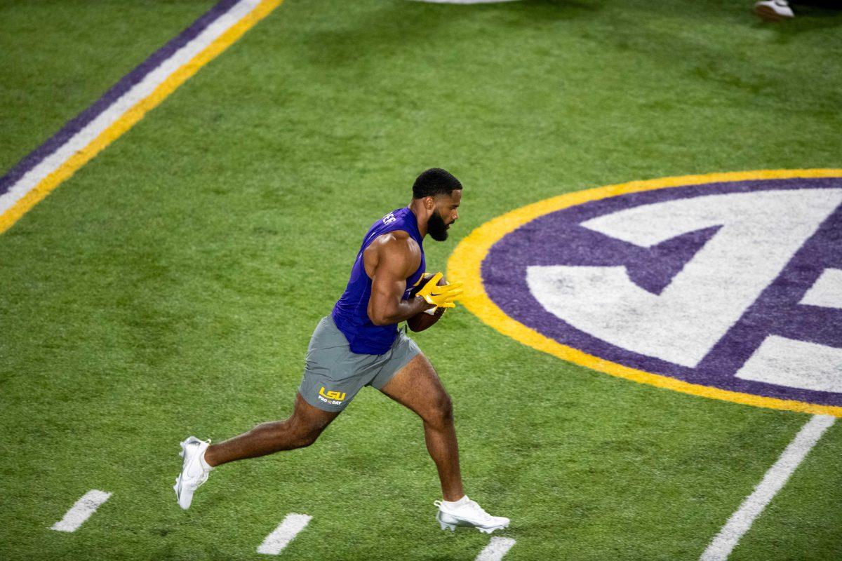 LSU football linebacker Omar Speights (1) runs the ball during LSU Pro Day on Wednesday, March 27, 2024, in Baton Rouge, La.