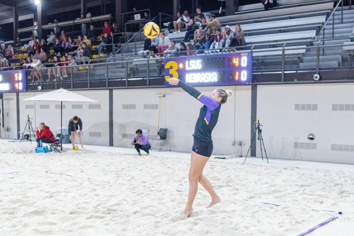 LSU beach volleyball senior Brooke Blutreich (31) hits the ball up Saturday, March 2, 2024, during LSU&#8217;s 5-0 win against Nebraska at the LSU Beach Volleyball Stadium in Baton Rouge, La.