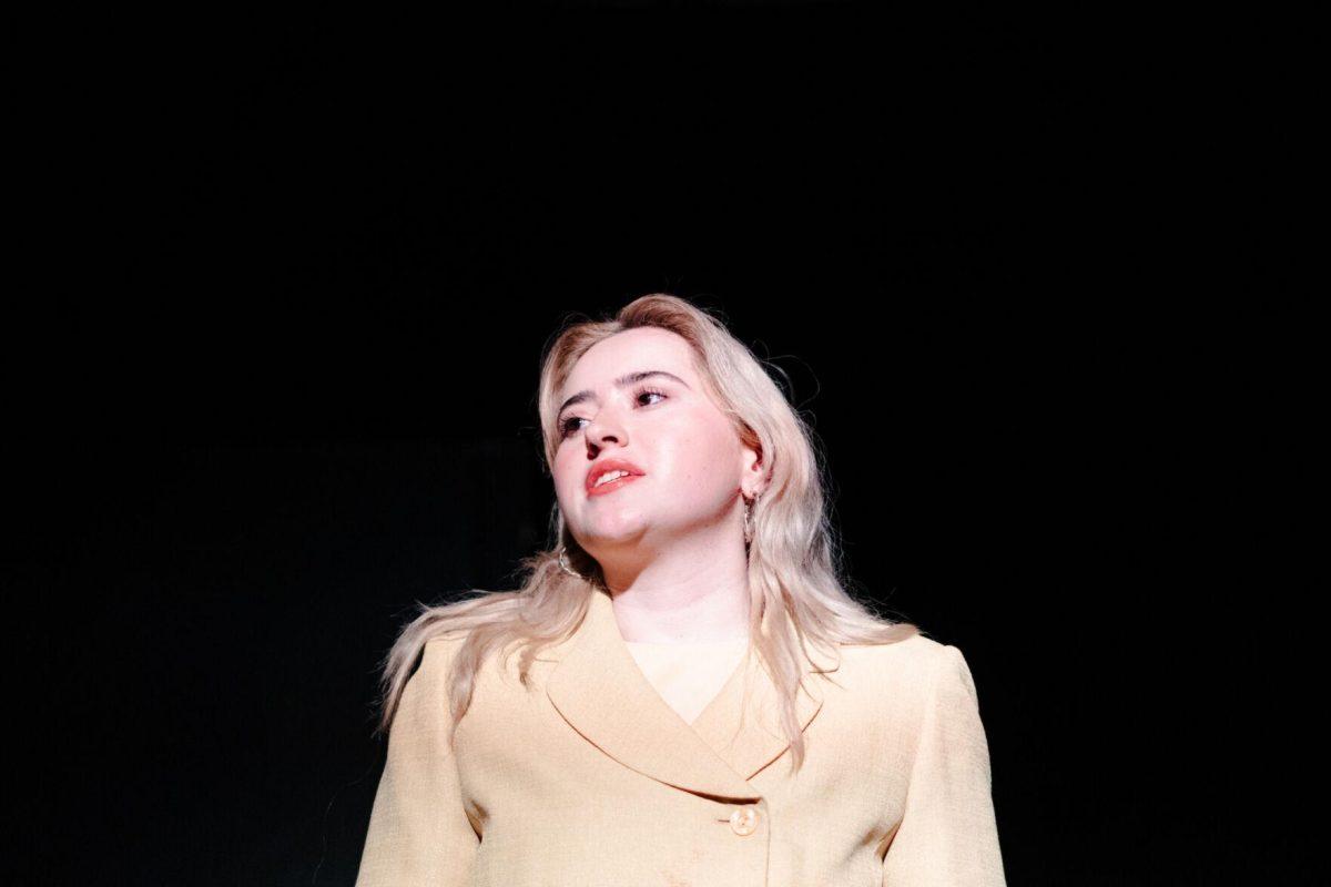 Older Nich Carraway (Sophie Rollins) speaks in a production of Yearning Sunday, March 3, 2024, in Coates Hall on LSU's campus.