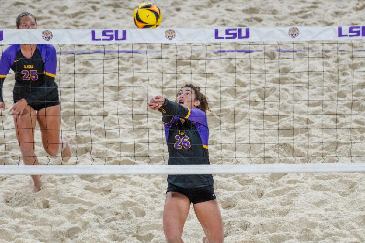 LSU beach volleyball freshman Yali Ashush (26) hits the ball up Saturday, March 2, 2024, during LSU&#8217;s 5-0 win against Nebraska at the LSU Beach Volleyball Stadium in Baton Rouge, La.