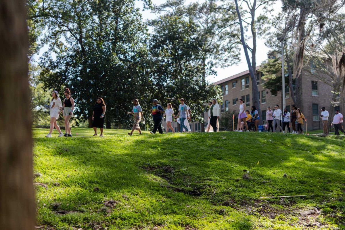 Attendees walk the route in silence Tuesday, March 26, 2024, at the Believe March on LSU's campus.