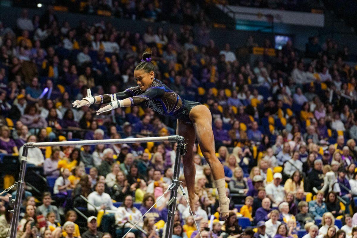 LSU gymnastics all-around senior Haleigh Bryant flies in the air Friday, March 1, 2024, during LSU&#8217;s 198.325-197.325 win against Alabama in the Pete Maravich Assembly Center in Baton Rouge, La.