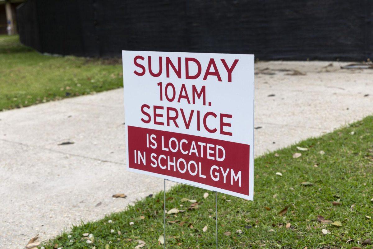 A Sunday 10 a.m. service sign sits outside the burnt remains of St. Luke's Episcopal Church Friday, March 8, 2024, on 8833 Goodwood Blvd, Baton Rouge, La.