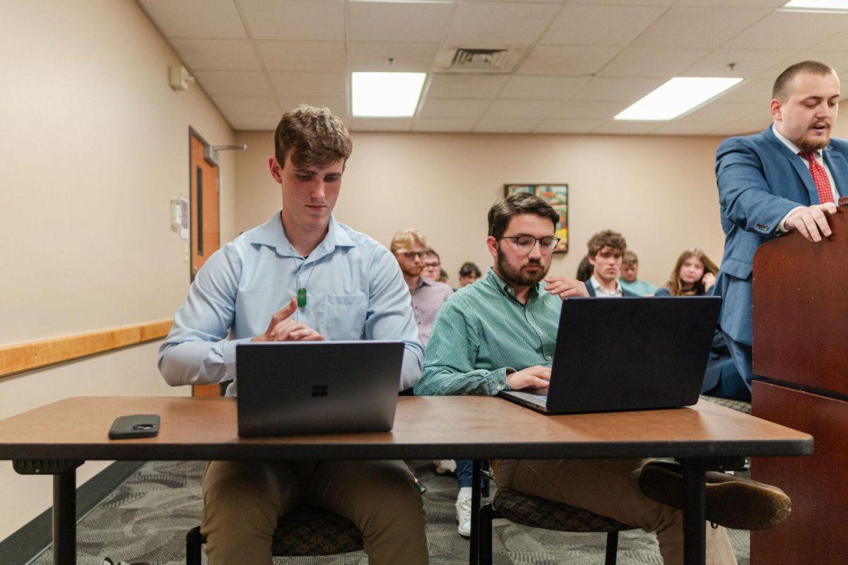 John Michael Sweat and Cooper Ferguson listen to John-Michael Shiner's rebuttal Monday, March 25, 2024, inside the LSU Student Union.