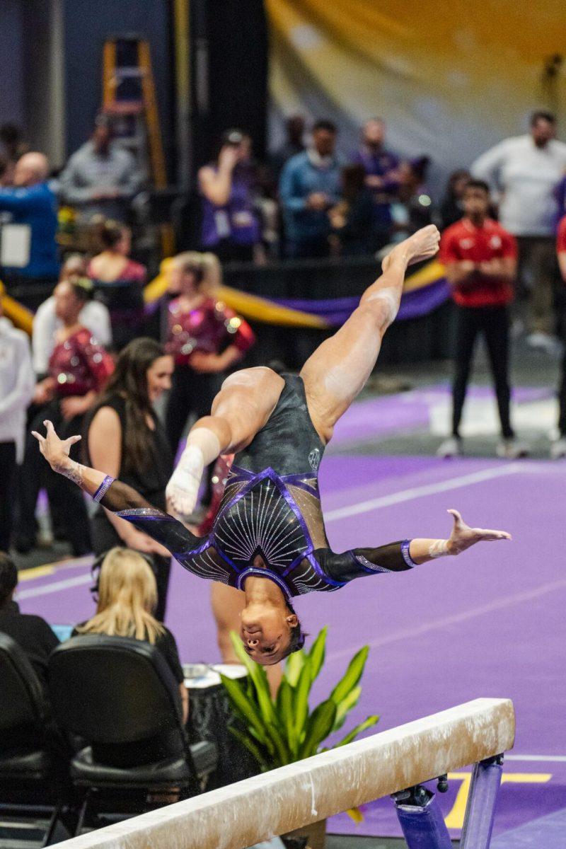 LSU gymnastics all-around senior Haleigh Bryant flips through the air Friday, March 1, 2024, during LSU&#8217;s 198.325-197.325 win against Alabama in the Pete Maravich Assembly Center in Baton Rouge, La.