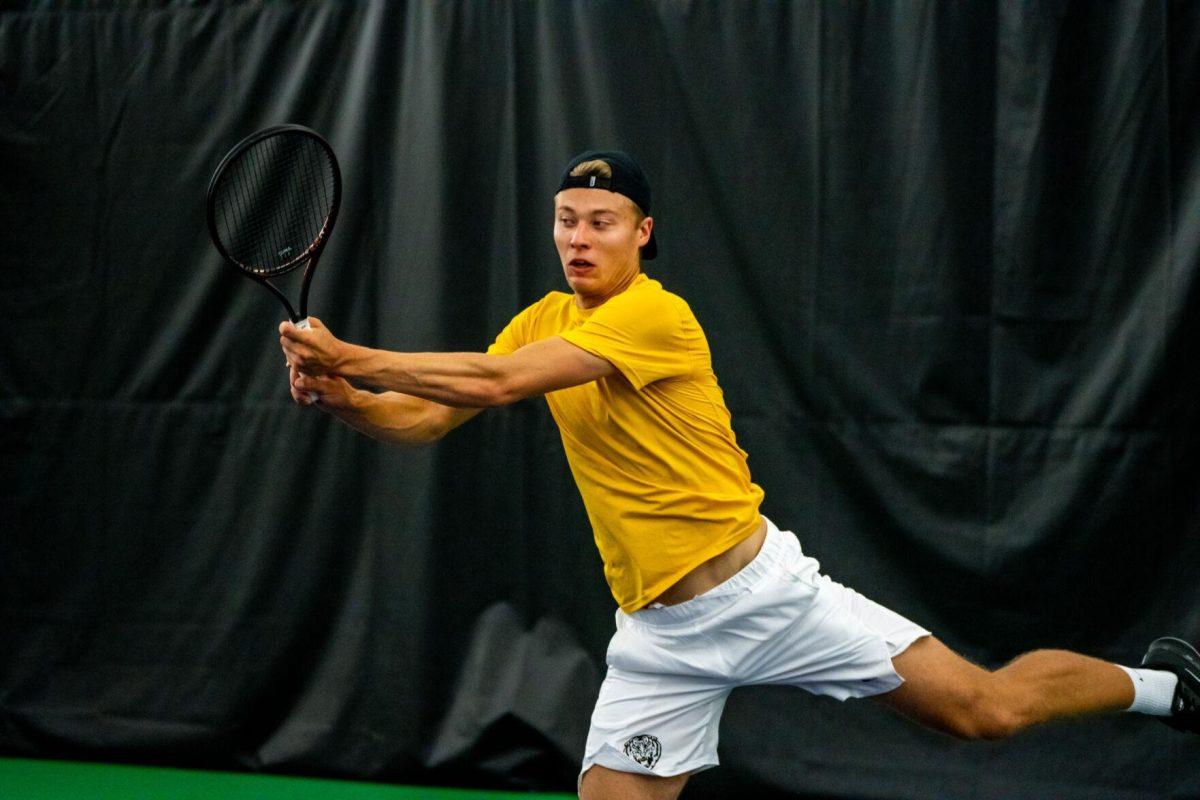 LSU men's tennis freshman Aleksi Lofman hits a backhand during his 5-7 doubles match against Ole Miss Friday, March 8, 2024, at the LSU tennis complex on Gourrier Avenue in Baton Rouge, La.