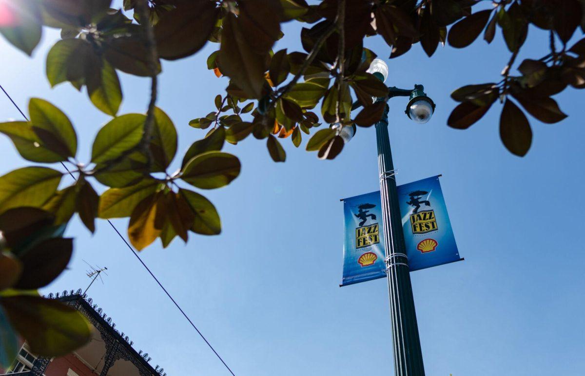 Jazz Fest banners hang from a lamppost Friday, March 29, 2024, on North Rampart Street in New Orleans, La.