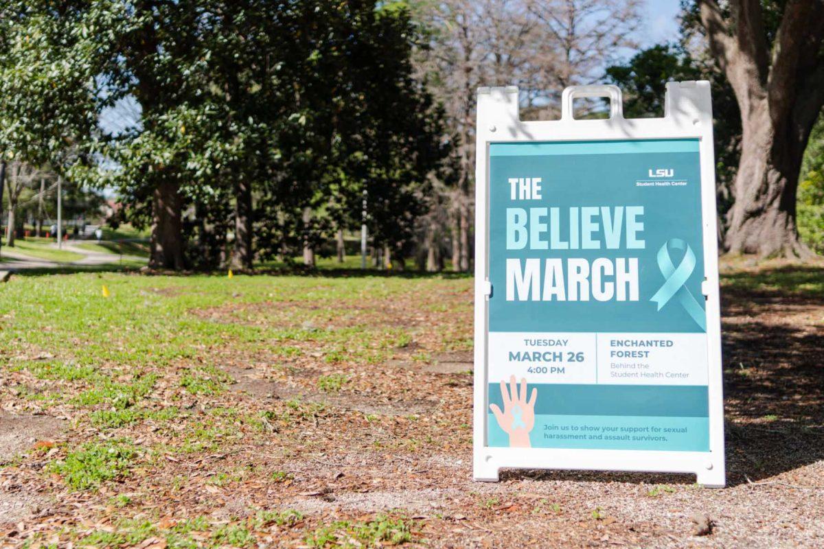 A sign directs participants toward the Believe March Tuesday, March 26, 2024, near the Enchanted Forest on LSU's campus.