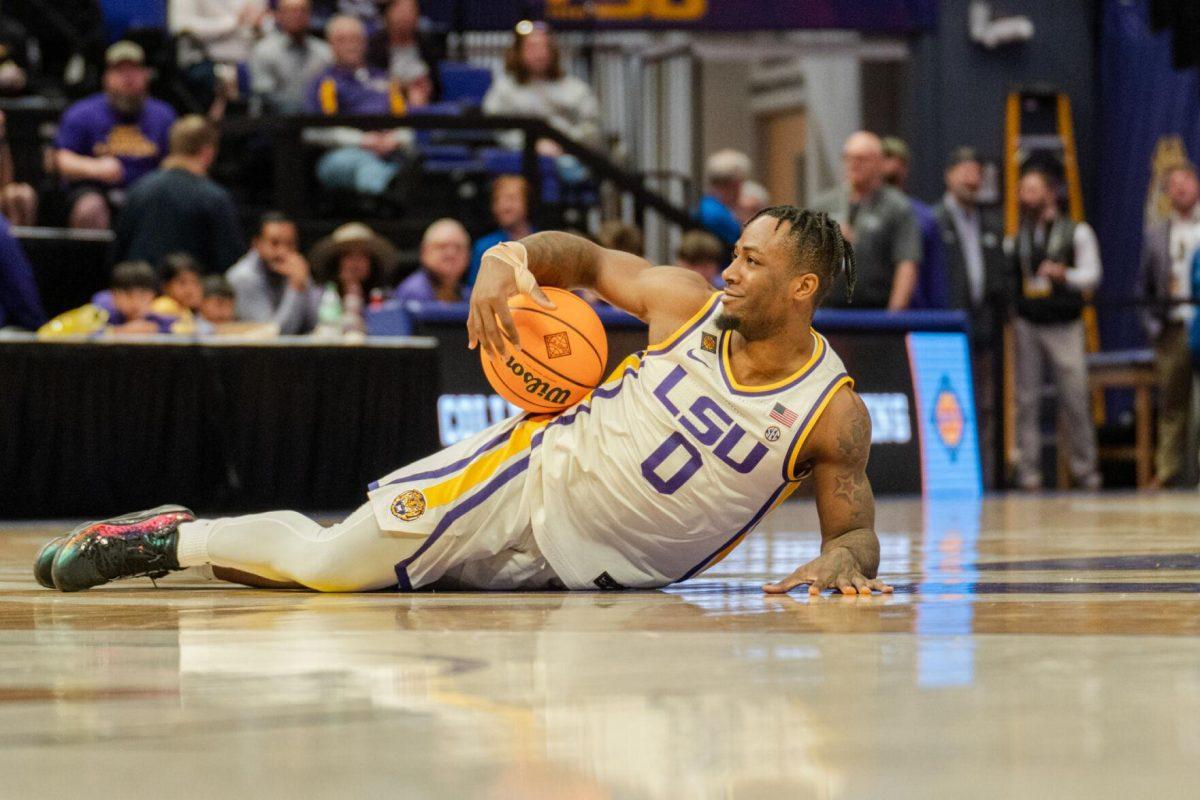 LSU men&#8217;s basketball 5th-year senior guard Trae Hannibal (0) holds the ball while on the floor Tuesday, March 19, 2024, during LSU&#8217;s 84-77 loss to the University of North Texas at the PMAC in Baton Rouge, La.